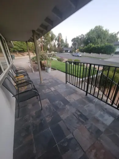 Spacious patio with seating at The House of Courage, a sober living home in Los Angeles.